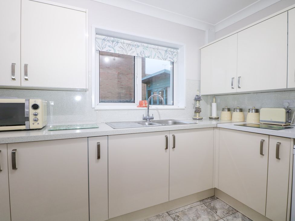 A kitchen with cabinets and a sink at 24 Dunkirk Close in Romney Marsh