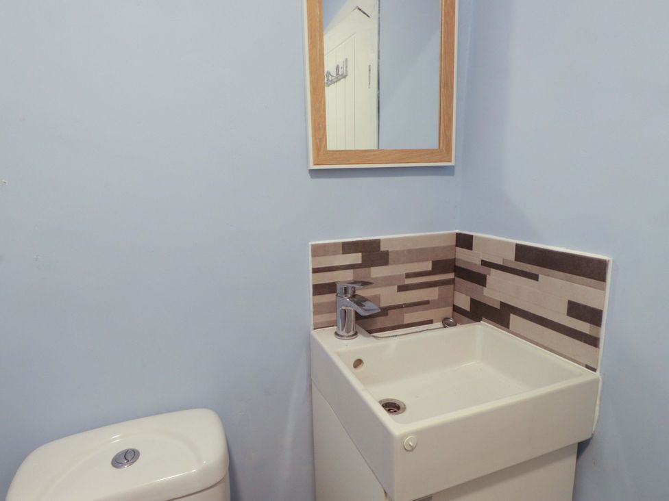 A bathroom with a sink and toilet at Ty Crigyll in Holyhead