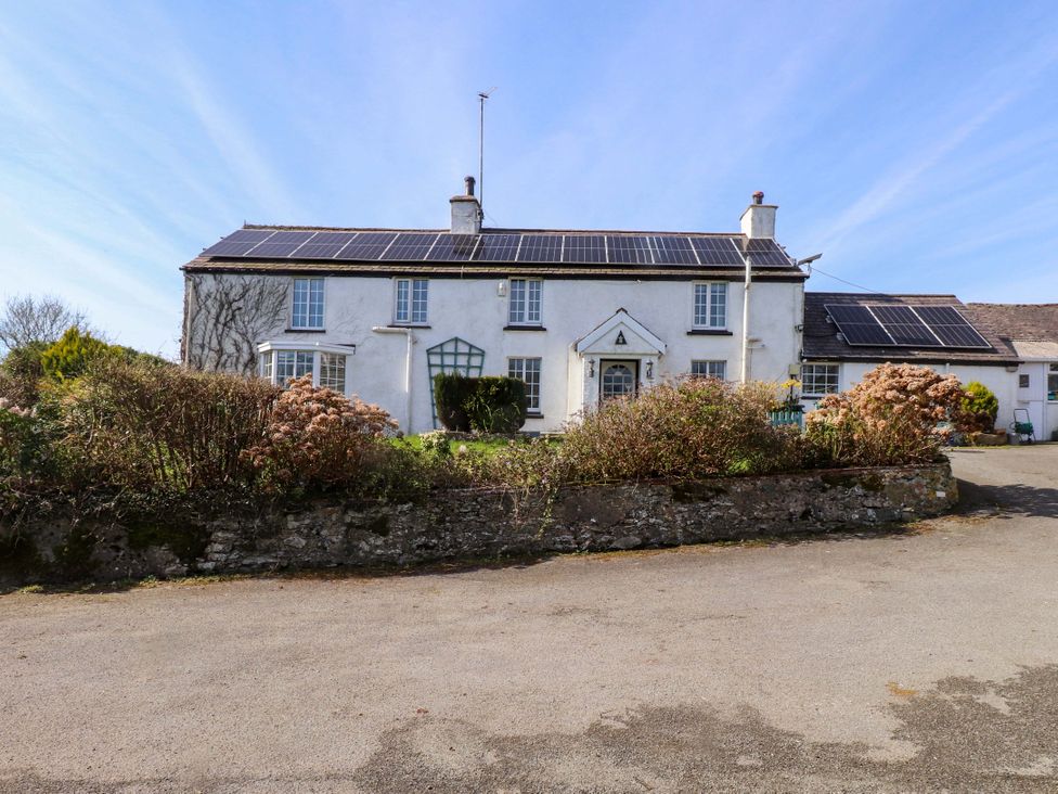 A house with solar panels and garden at Ty Crigyll in Caergeiliog
