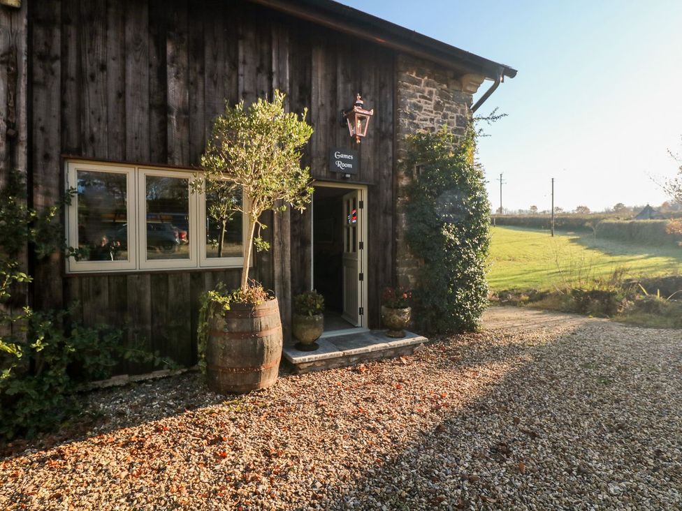 An entrance with a barrel and plants at Lake View in Crediton