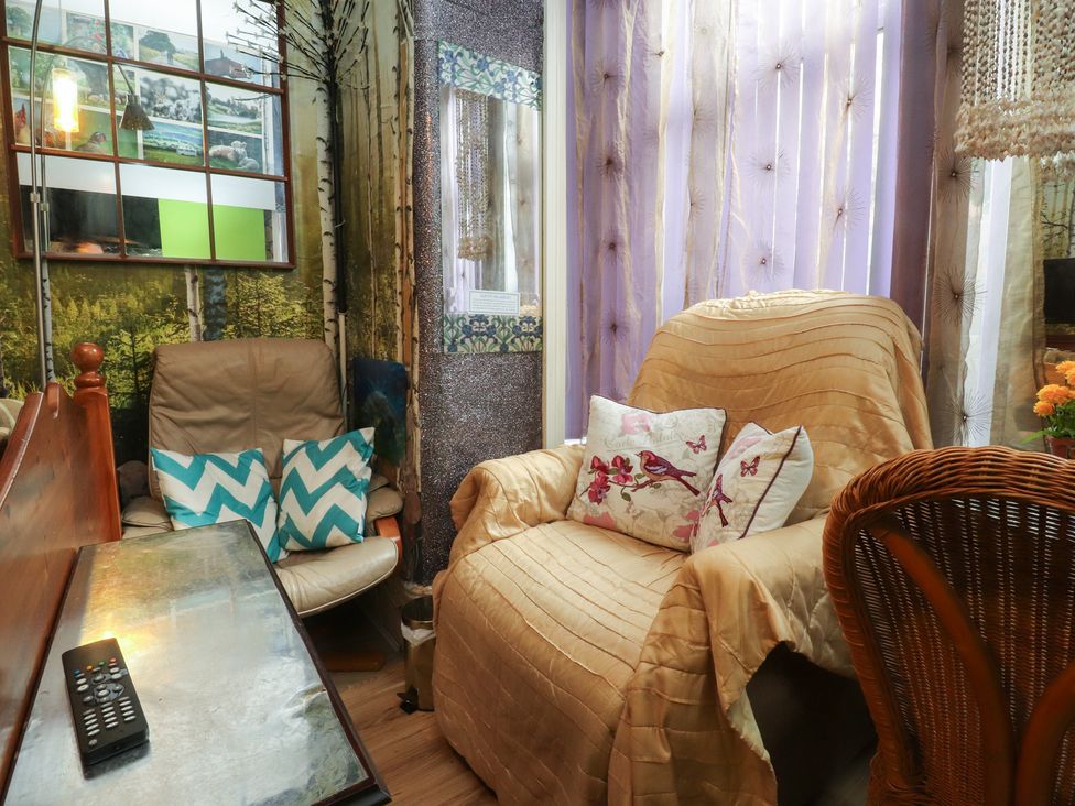 A snug with an armchair and side table at Number 1 in Blackpool