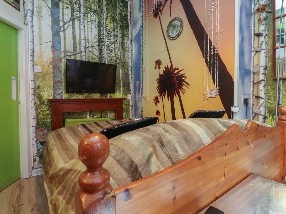 A bedroom with a bed and television at Number 1 Blackpool