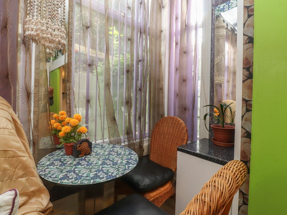 A dining area with a table and chairs at Number 1 Blackpool