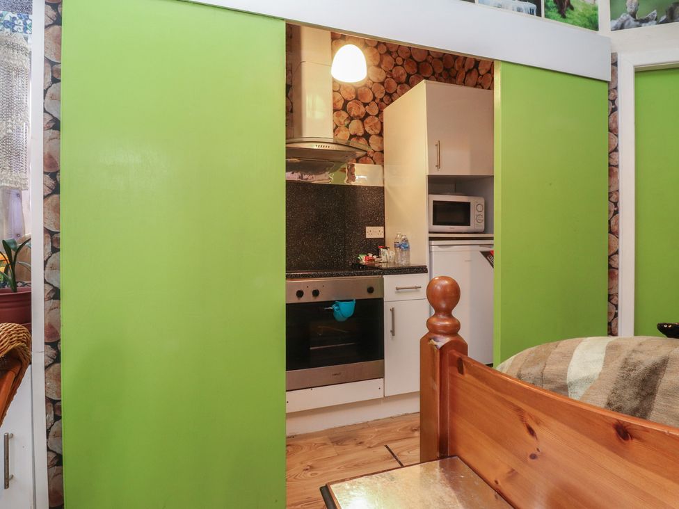 A kitchen with cabinets and appliances at Number 1 in Blackpool