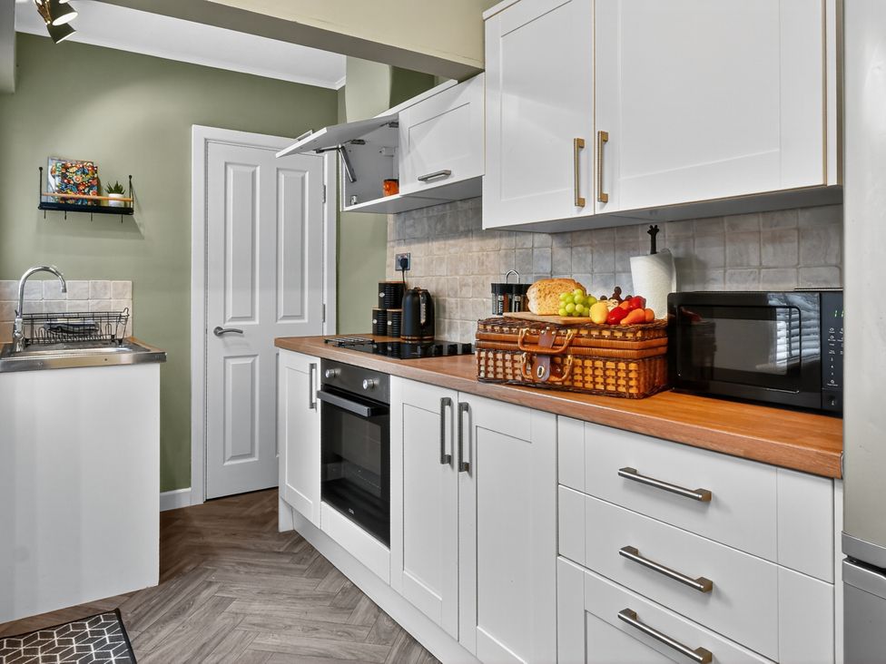 A kitchen with a sink and appliances at Windsor House in York