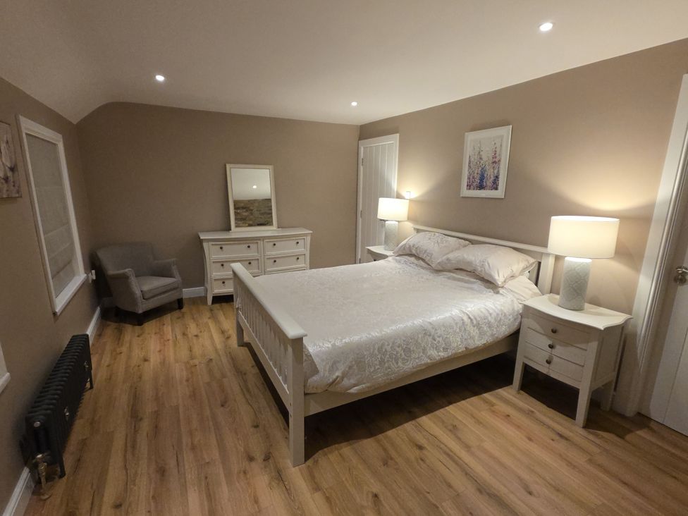A bedroom with a bed and furniture at Annie’s Farm Cottage Near Londonderry, Northern Ireland