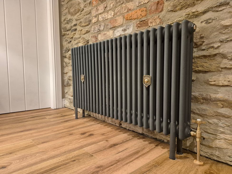 A radiator by the wall at Annie’s Farm Cottage near Londonderry, Northern Ireland