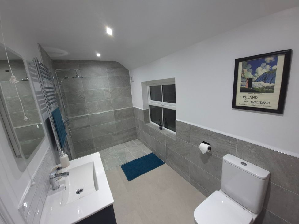 A bathroom with a shower, sink, and toilet at Annie’s Farm Cottage near Londonderry, Northern Ireland