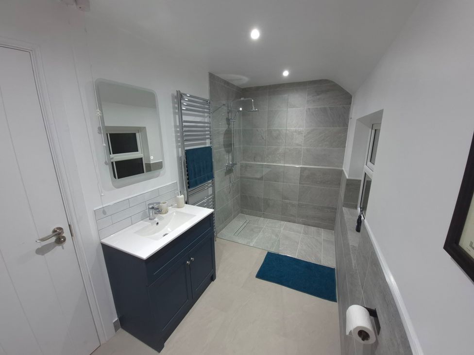 A bathroom with a shower and sink at Annie’s Farm Cottage Near Londonderry, Northern Ireland