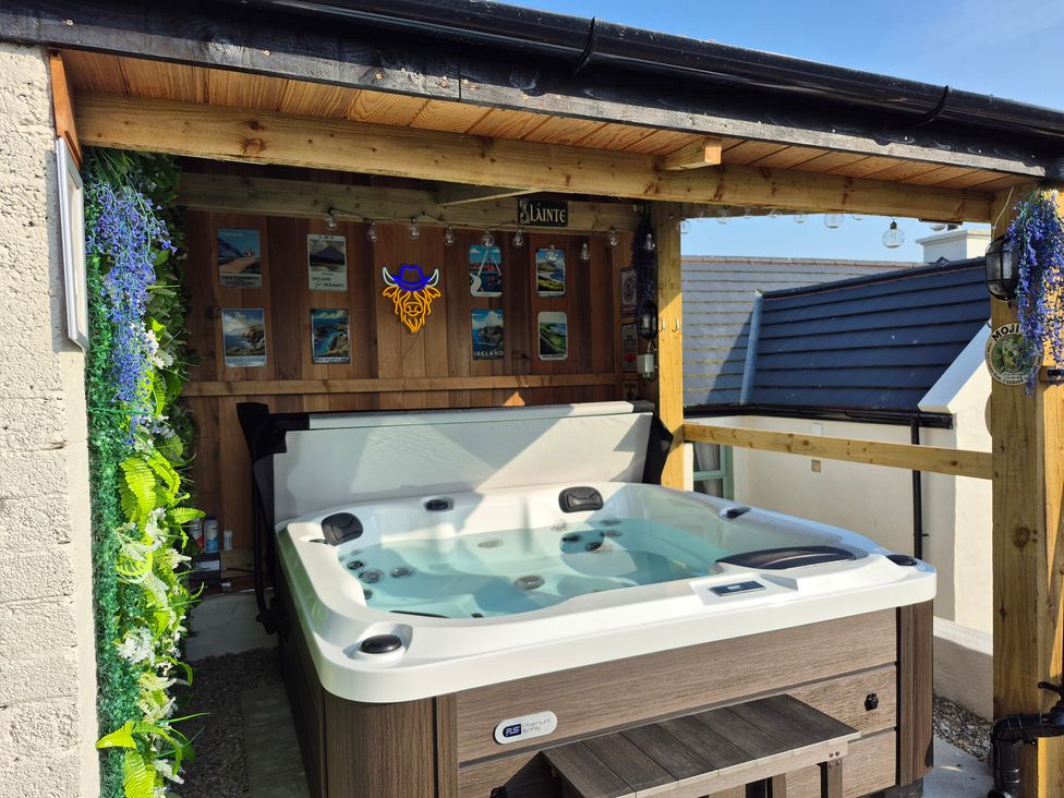 An outdoor area with a hot tub and wooden structure at Annie’s Farm Cottage Near Londonderry, Northern Ireland