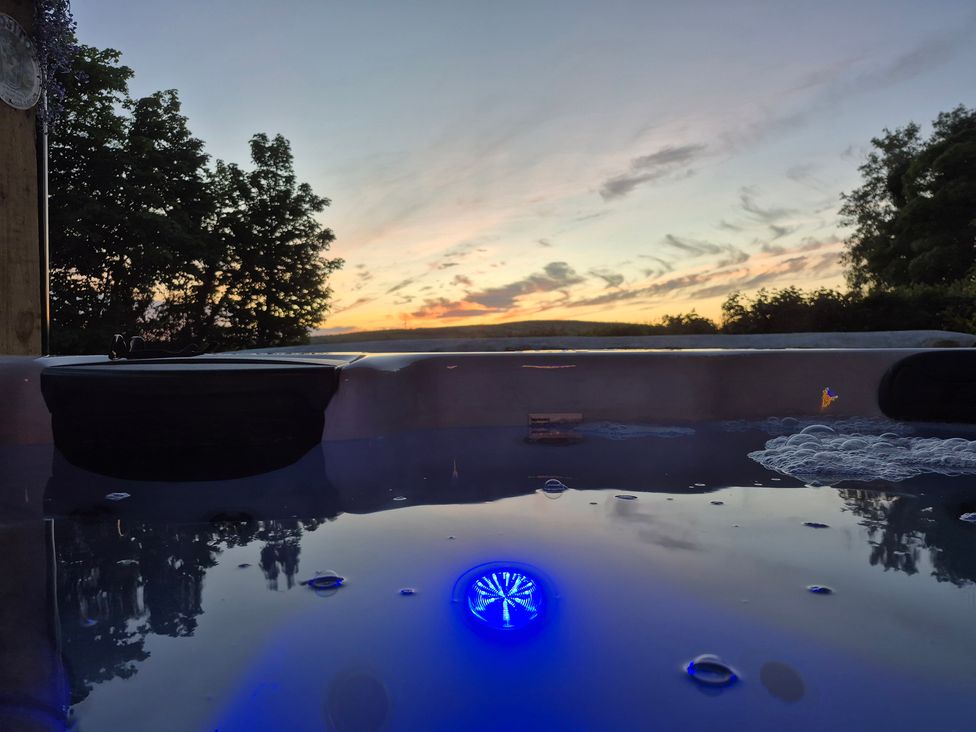 A hot tub with water and bubbles at Annie’s Farm Cottage Near Londonderry, Northern Ireland