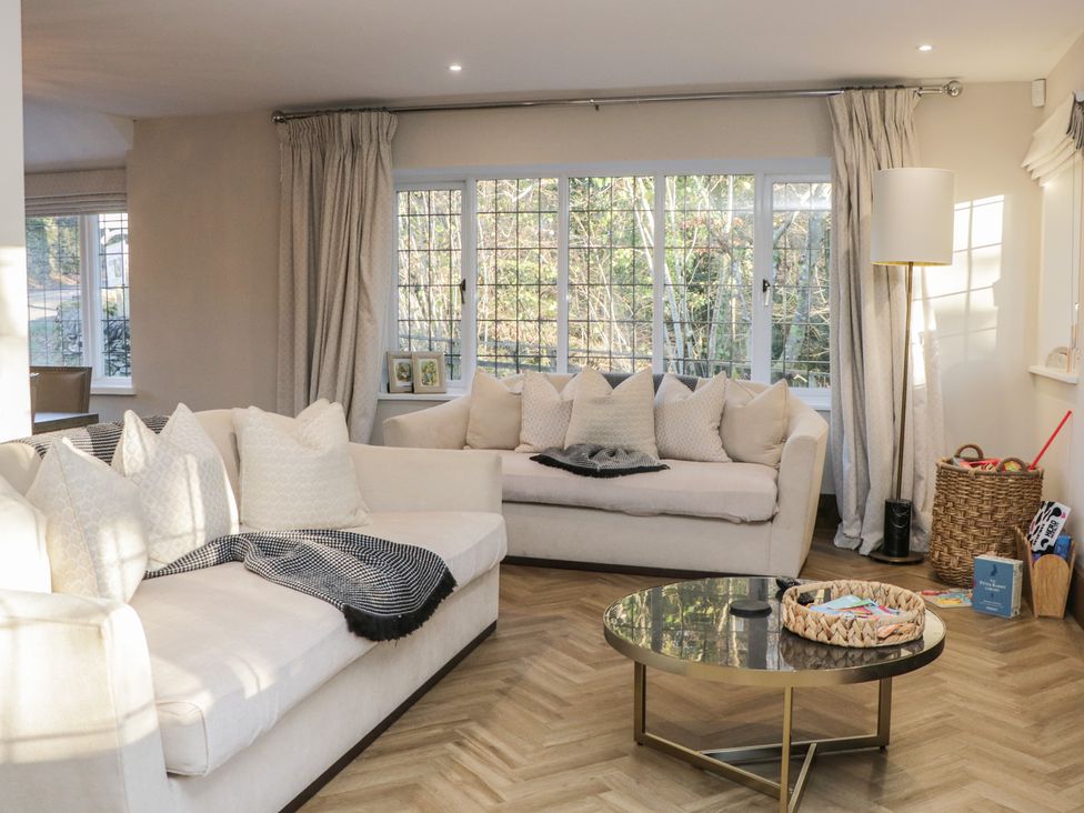 A living room with sofas and a coffee table at North Cottage in Bowness-On-Windermere