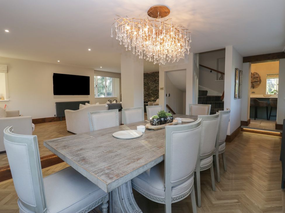 A dining room with a table and chairs at North Cottage Bowness-On-Windermere