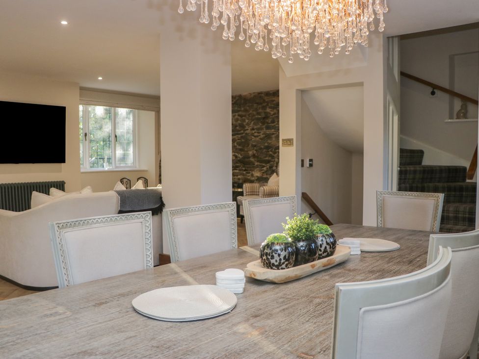 A dining room with a table and chairs at North Cottage Bowness-On-Windermere