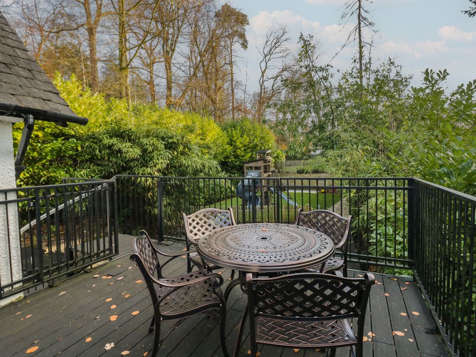 An outdoor space with a table and chairs at North Cottage Bowness-On-Windermere