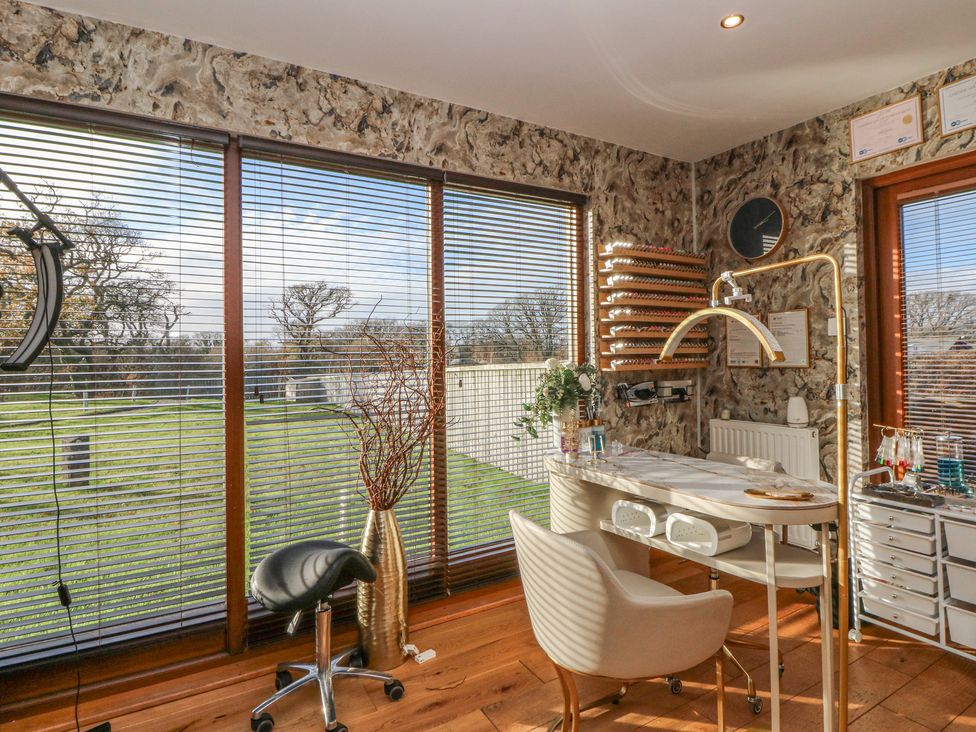 An office with a desk and chair at Garden Lodge 10 Swansea