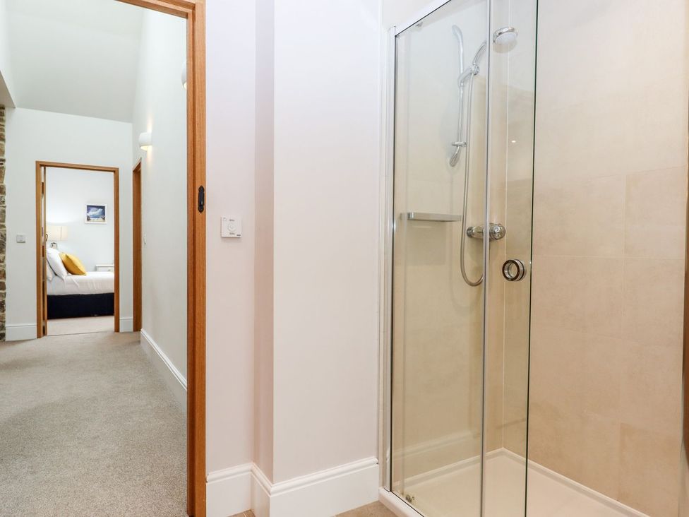 A bathroom with a shower cubicle at Knowle House in Okehampton