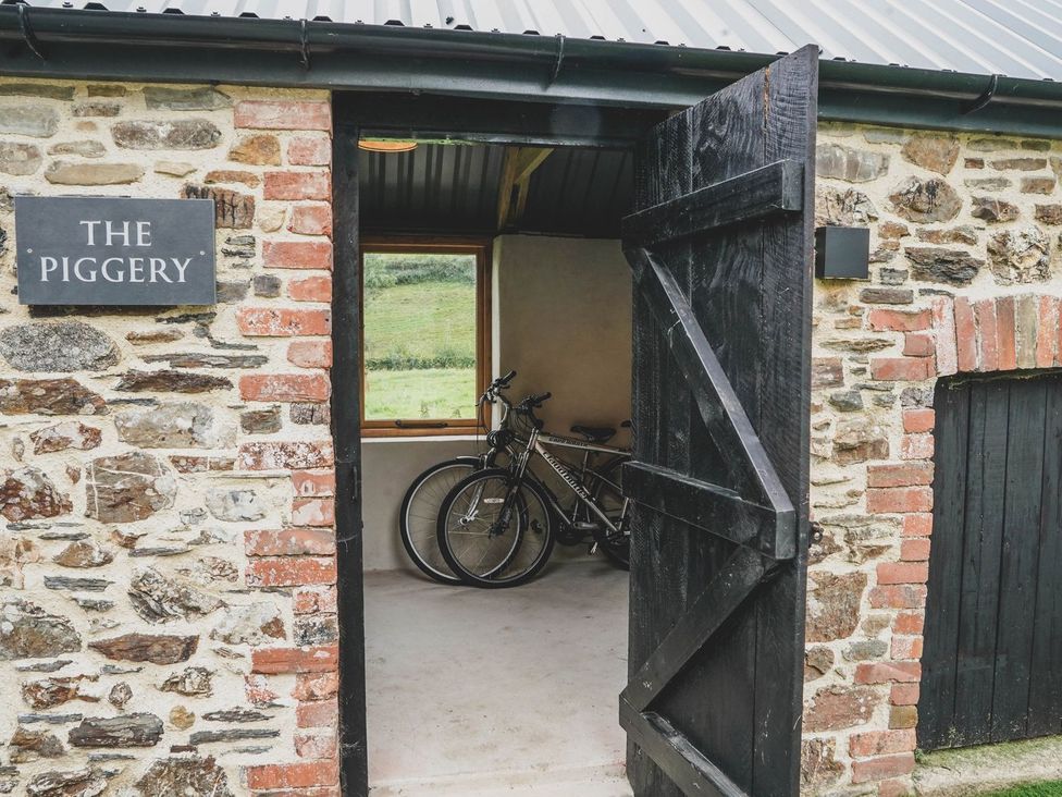 An entrance to The Piggery with bicycles inside at Knowle House in Okehampton