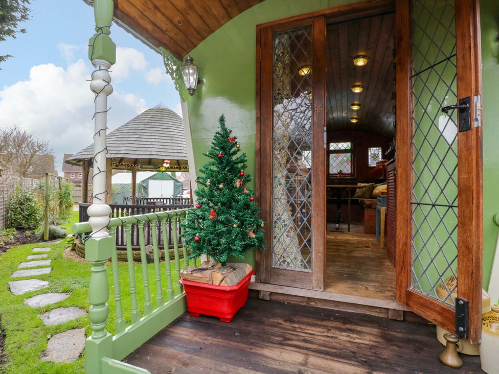 A garden path with a Christmas tree at The Gypsy Caravan in Marlborough