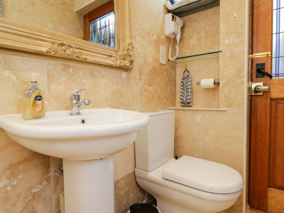 A bathroom with a sink and toilet at The Gypsy Caravan in Marlborough