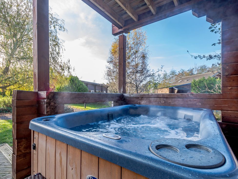 A hot tub in an outdoor area at Birch Waterside Spa Carlton Miniott near Thirsk