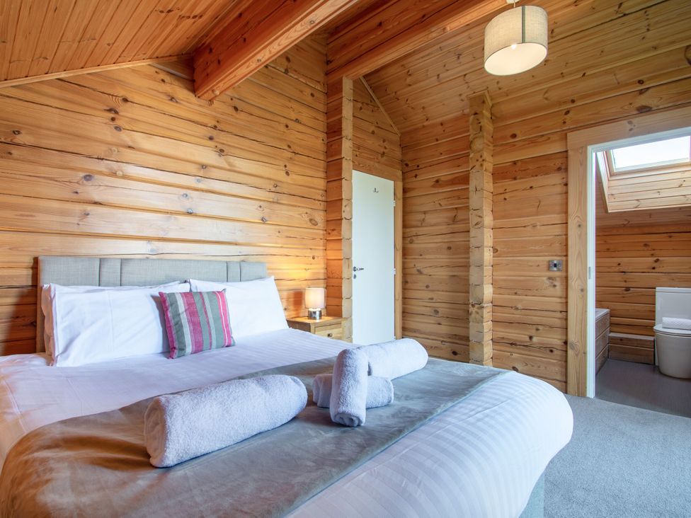 A bedroom with a bed and skylight at Birch Waterside Spa Carlton Miniott near Thirsk