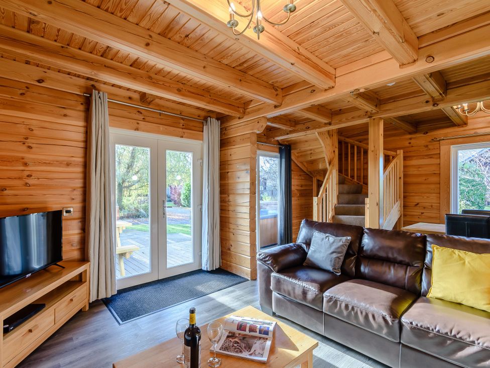 A living room with a television and sofa at Birch Waterside Spa (Pet) Carlton Miniott near Thirsk