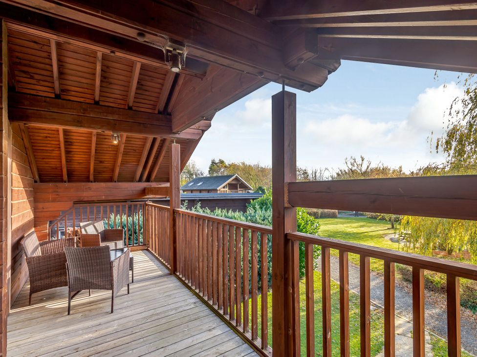 A balcony with outdoor furniture at Birch Spa (Pet) Carlton Miniott near Thirsk