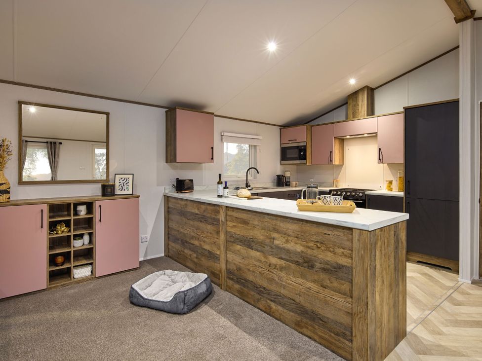 A kitchen with cabinets and a counter at Laurel Spa in Carlton Miniott near Thirsk