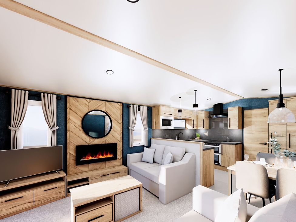 A living room with a sofa and dining table at Willow Waterside Spa Carlton Miniott near Thirsk