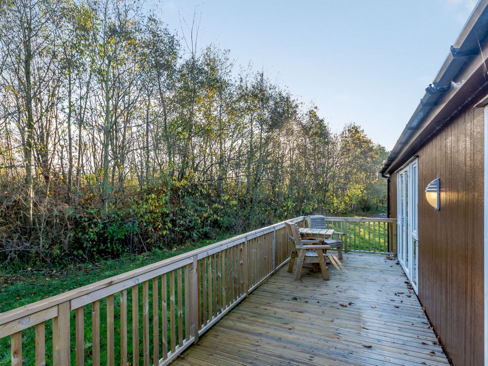 An outdoor area with decking and furniture at Cherry Tree in Carlton Miniott near Thirsk