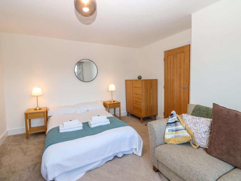 A bedroom with a bed and furniture at Mains Cottage Consett