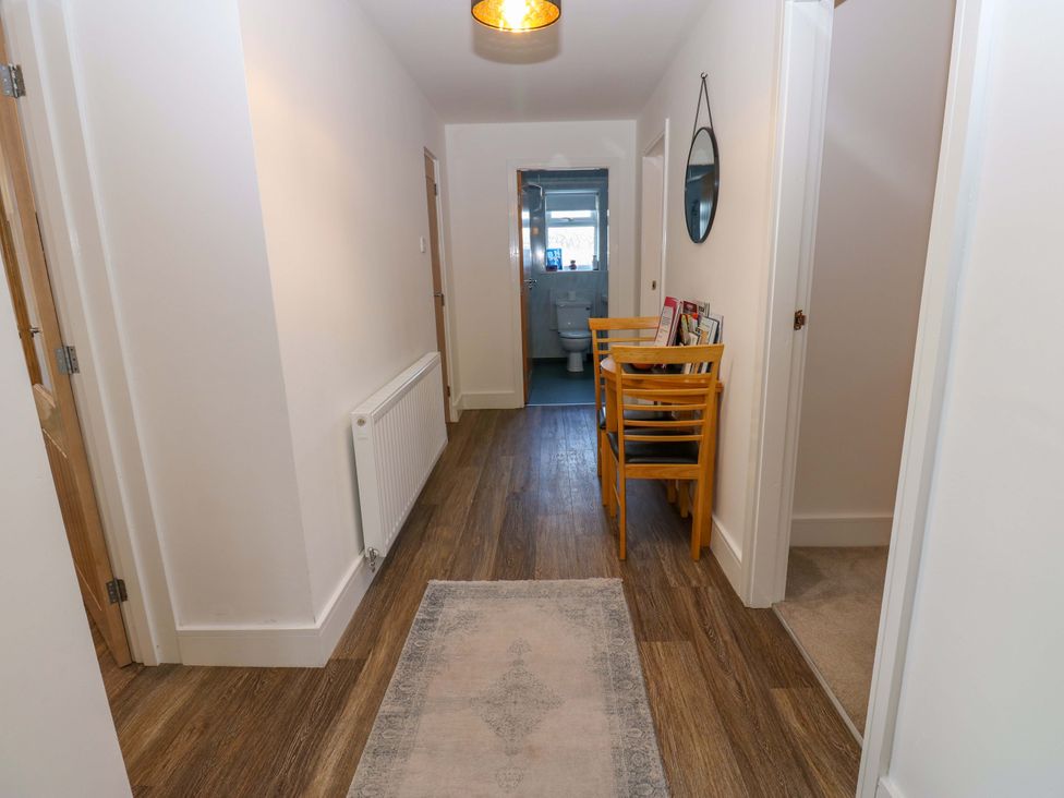 A hallway with a table and chairs at Mains Cottage in Consett