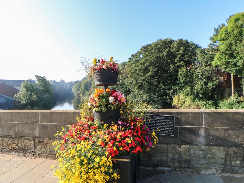 A flower arrangement on a bridge overlooking a river at Mains Cottage in Consett