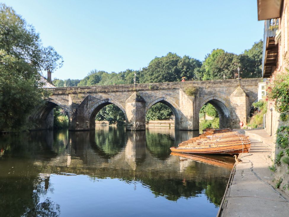 A bridge over water with boats at Mains Cottage in Consett
