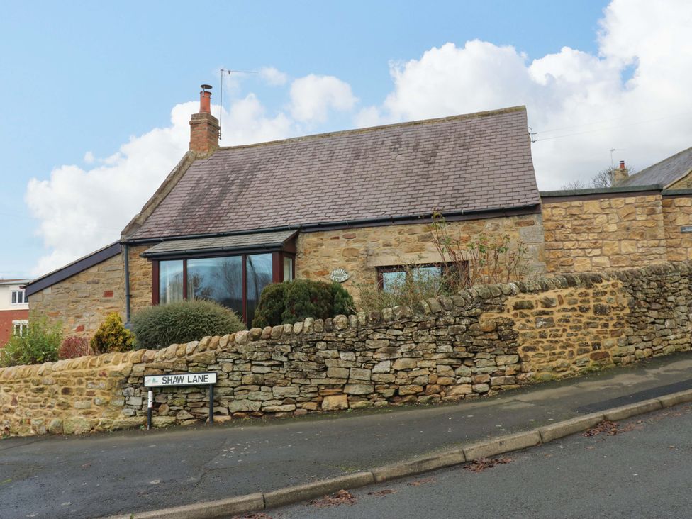 A house with stone wall and garden on Shaw Lane in Consett
