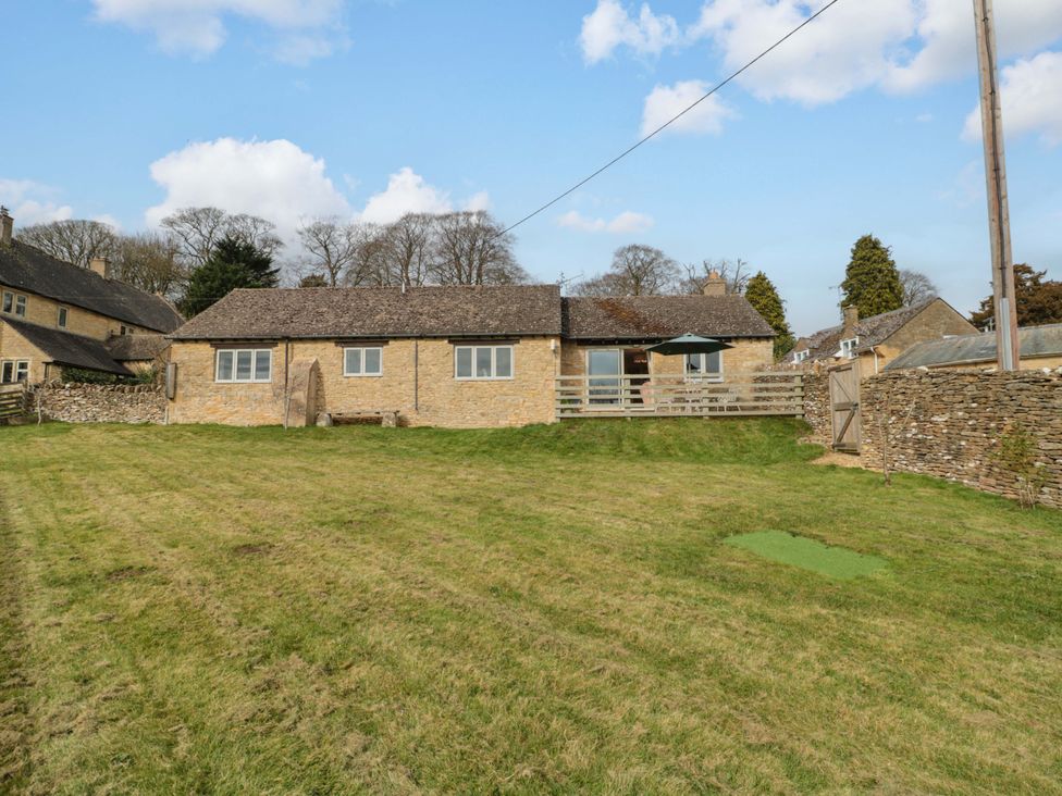 A house with a grassy area and a patio at Daisy Bank in Maugersbury near Stow-On-The-Wold