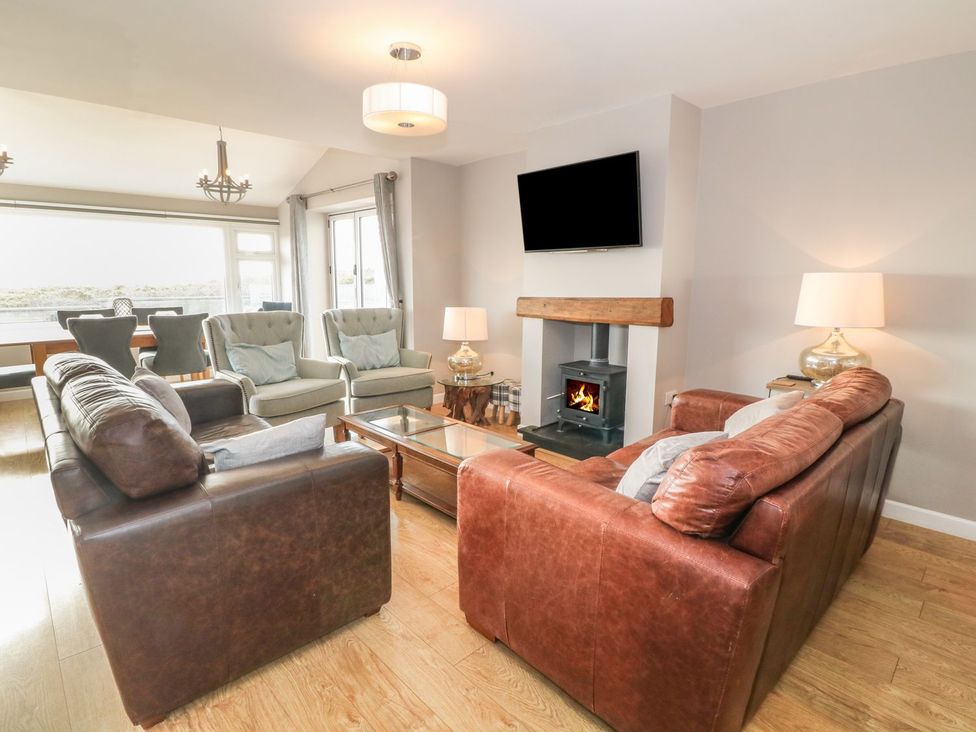 A living room with sofas and a fireplace at Dunholme