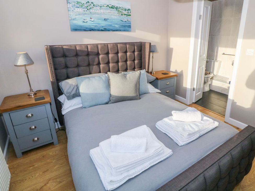 A bedroom with a bed and bedside table at Dunholme