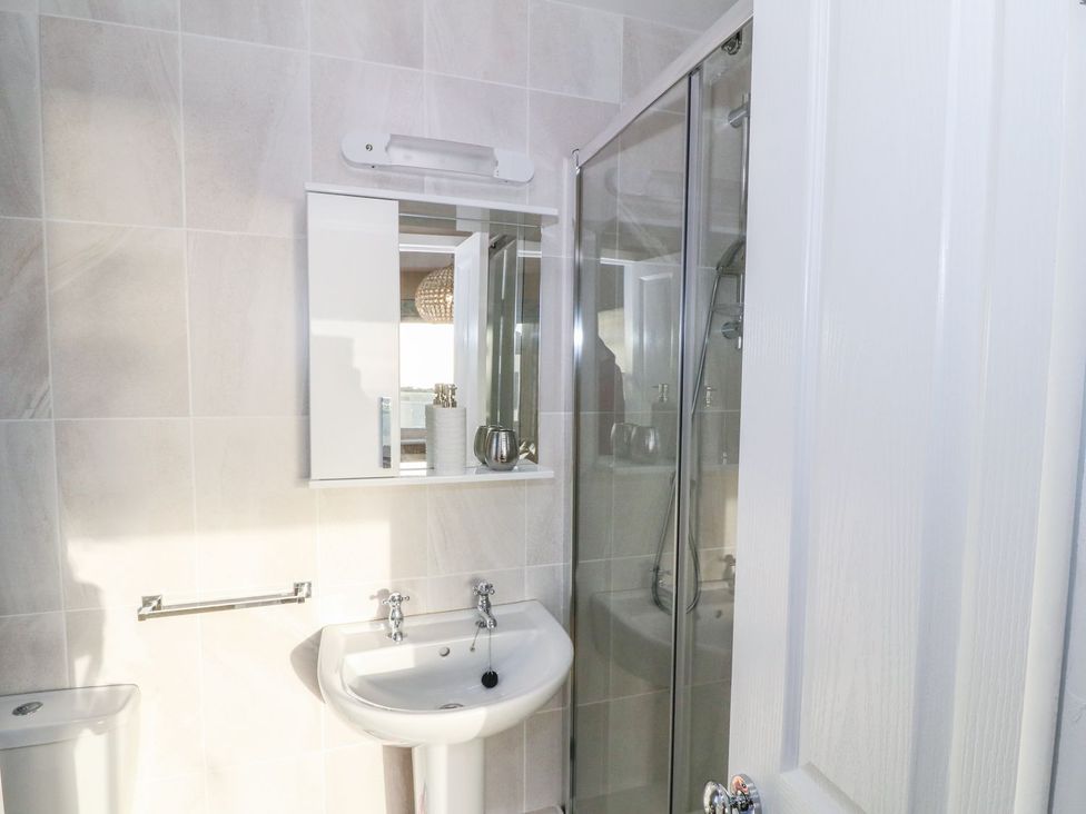 A bathroom with a sink and shower at Dunholme