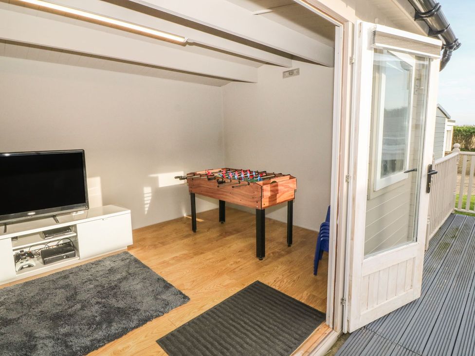 A snug with foosball table and television at Dunholme