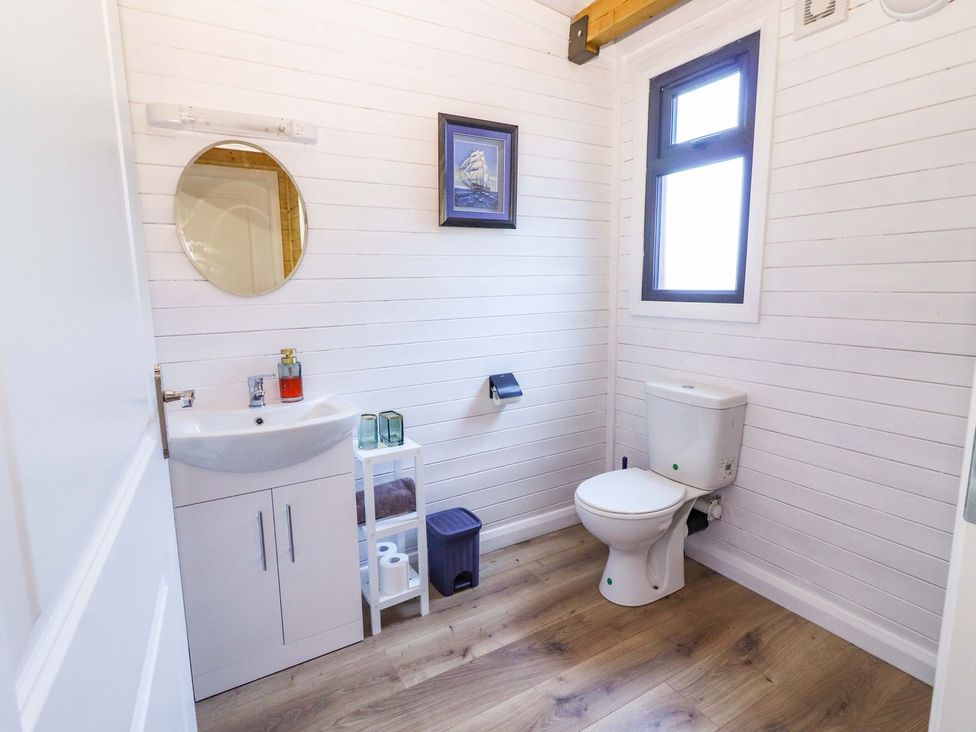 A bathroom with a sink and toilet at Killinure Cottage in Glasson, County Westmeath