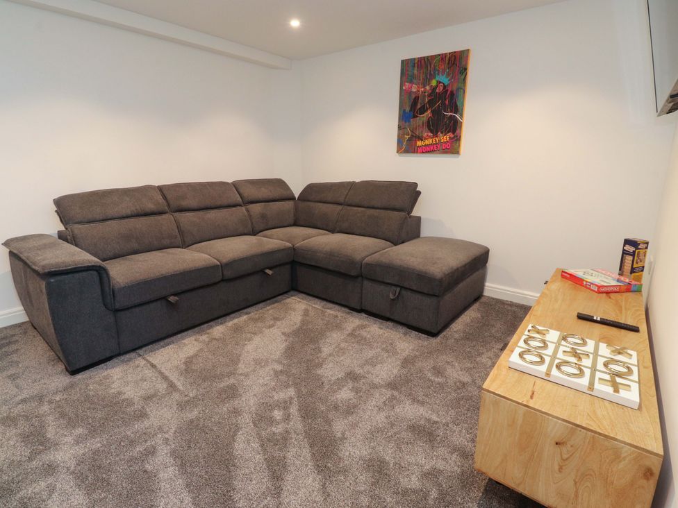 A living room with a sofa and coffee table at The Barn in Skipton