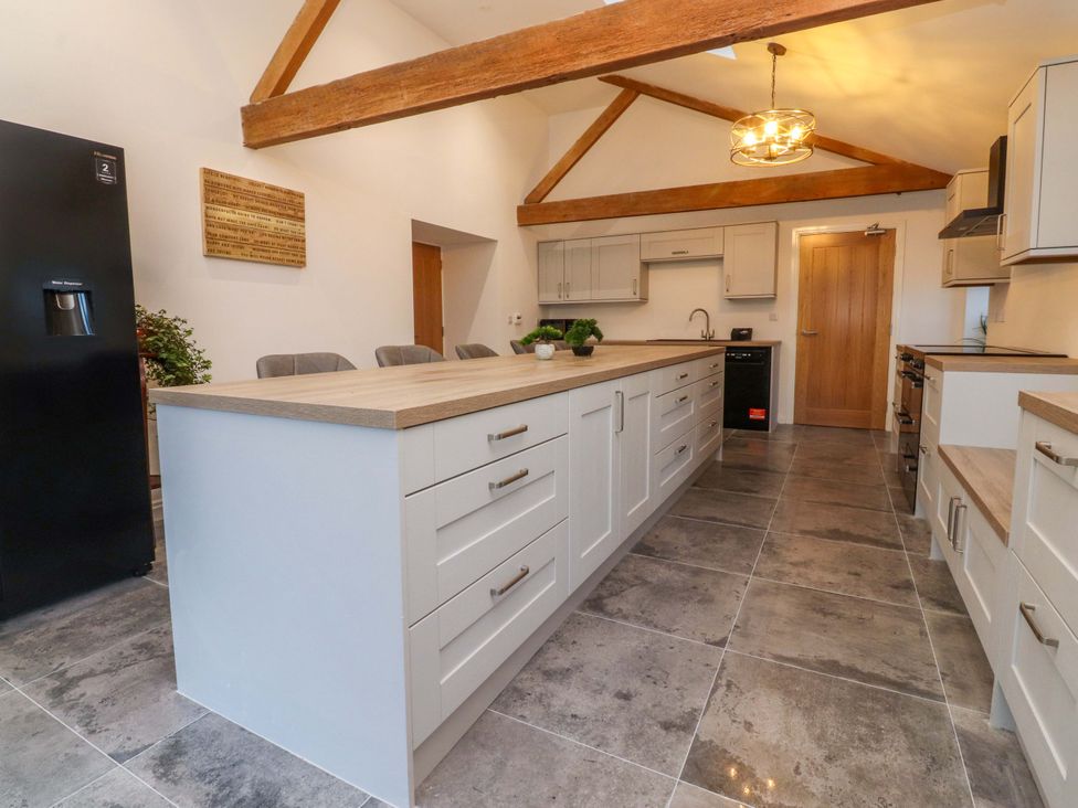 A kitchen with an island and appliances at The Barn in Skipton