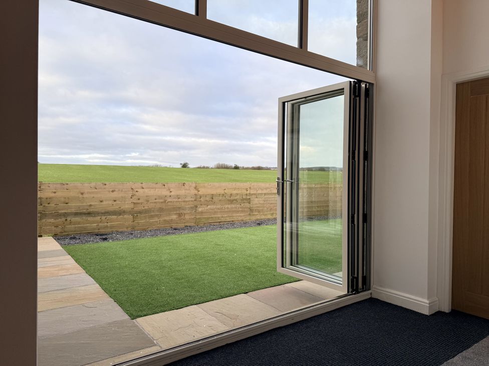 A door opening to a garden area at The Barn in Wigglesworth near Settle