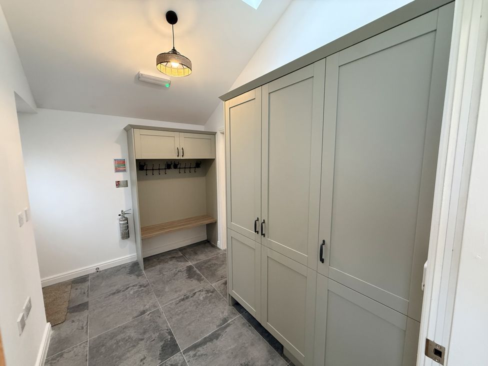 A mudroom with a bench and cabinets at The Barn in Wigglesworth near Settle