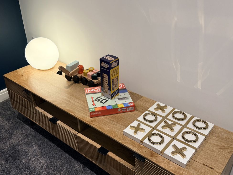 A console table with toys and games at The Barn in Wigglesworth near Settle