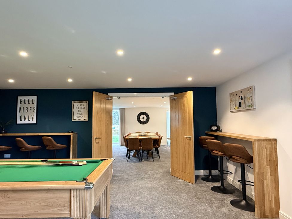 A games room with a pool table and dining area at The Barn in Wigglesworth near Settle
