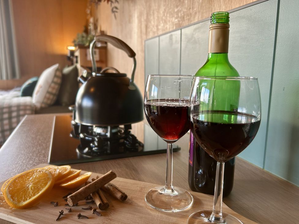 A kitchen area with wine glasses and a kettle at Harriet in Llangurig