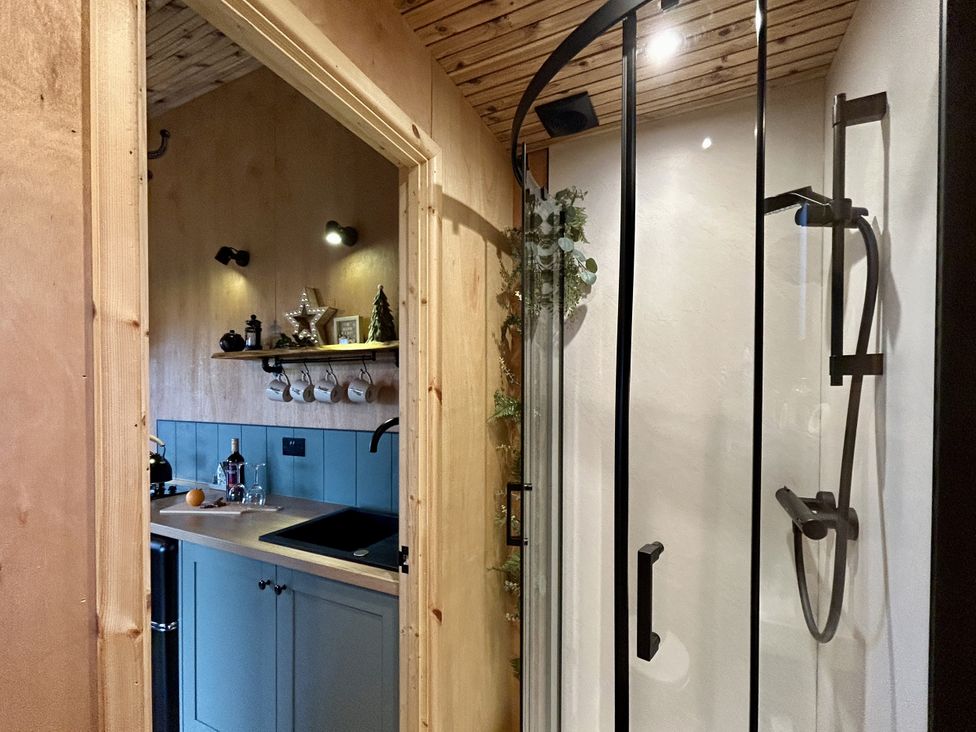 A kitchen with a sink and shower at Harriet in Llangurig